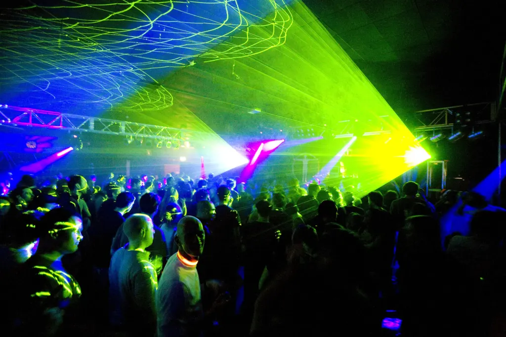 Crowd beneath green laser light at Bloc Weekend 2008 in Hemsby.